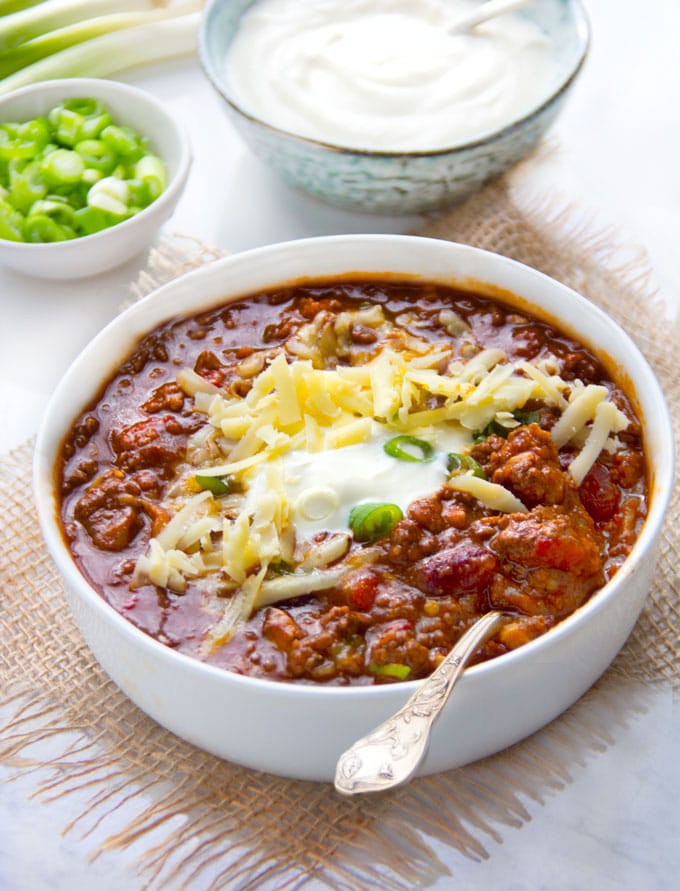 This Award Winning Chili recipe is hands down the BEST chili con carne I've ever tasted, with the most incredible flavor and texture - made with beef, pork, beans, awesome spices, onions, garlic, tomatoes and beer. Plus it freezes well so you might want to make a double batch.