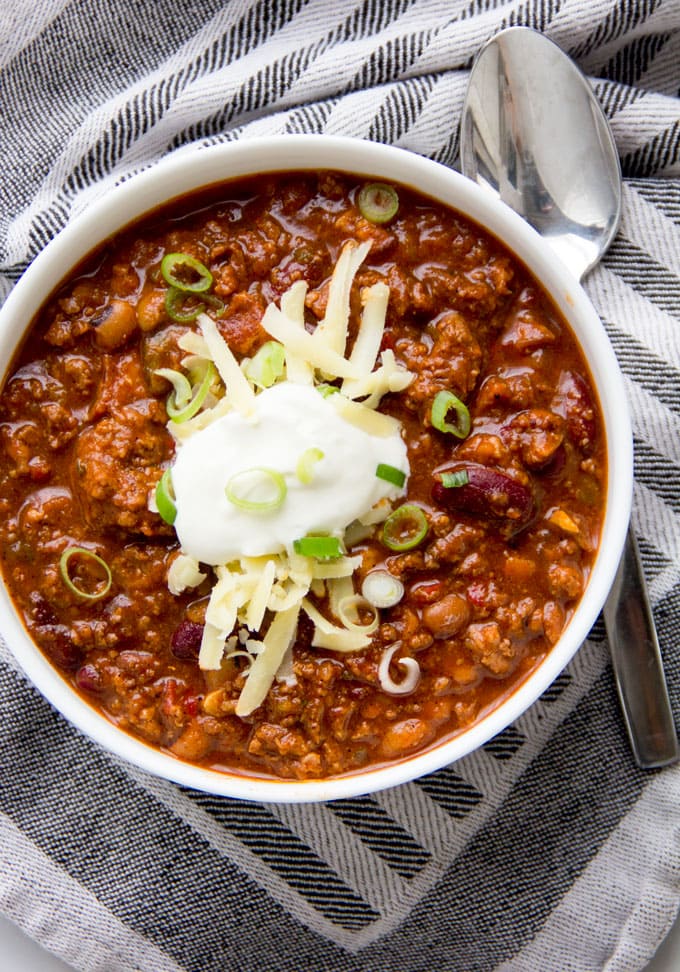 This Award Winning Chili recipe is hands down the BEST chili con carne I've ever tasted, with the most incredible flavor and texture - made with beef, pork, beans, awesome spices, onions, garlic, tomatoes and beer. Plus it freezes well so you might want to make a double batch.