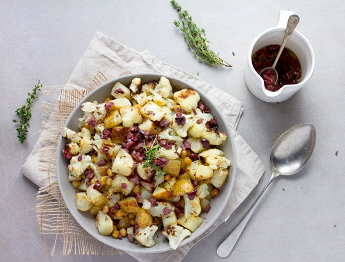 Roasted Cauliflower, Potatoes and Chickpeas tossed in a bright lemon olive vinaigrette. Serve as a side dish or vegetarian main. [gluten-free recipe]