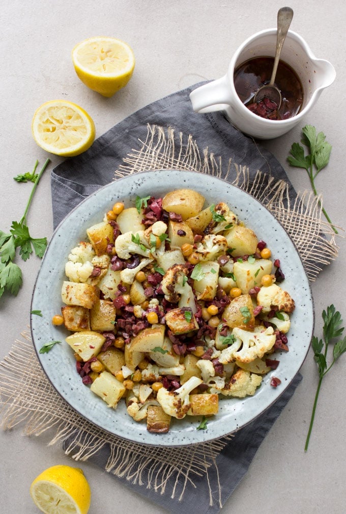 Roasted Cauliflower, Potatoes and Chickpeas tossed in a bright lemon olive vinaigrette. Serve as a side dish or vegetarian main. [gluten-free recipe]