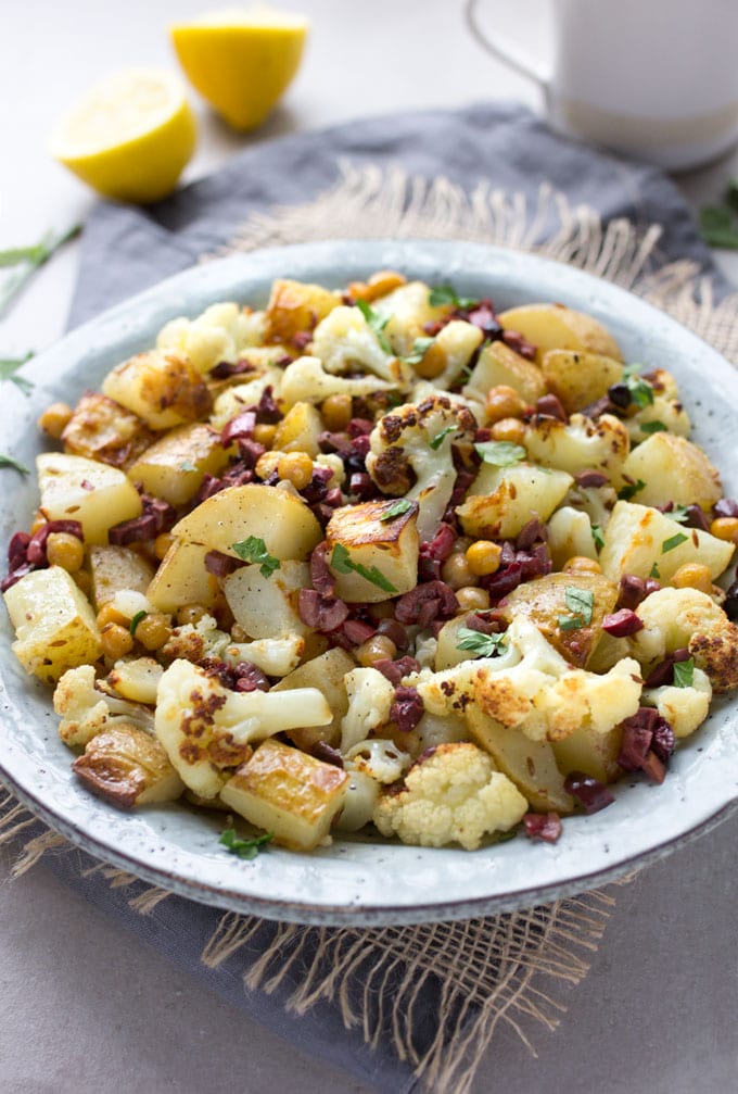 Roasted Cauliflower, Potatoes and Chickpeas tossed in a bright lemon olive vinaigrette. Serve as a side dish or vegetarian main. [gluten-free recipe]