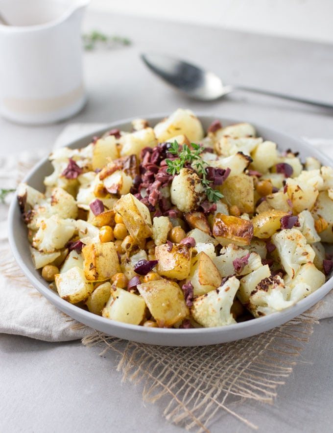 Roasted Cauliflower, Potatoes and Chickpeas tossed in a bright lemon olive vinaigrette. Serve as a side dish or vegetarian main. [gluten-free recipe]