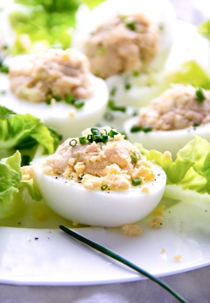 close up of 5 Deviled eggs mimosa on a bed of lettuce