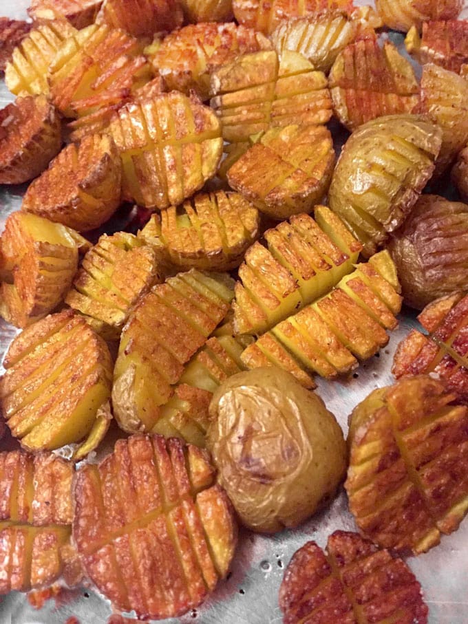 Mini inside-out hasselback potatoes are crisscross-cut mini potatoes that roast up extra golden brown and crispy on the outside and creamy inside. Whether you season these with salt and pepper or fancy them up with truffle salt and grated parmesan, they're delicious and fun and everyone will love them!