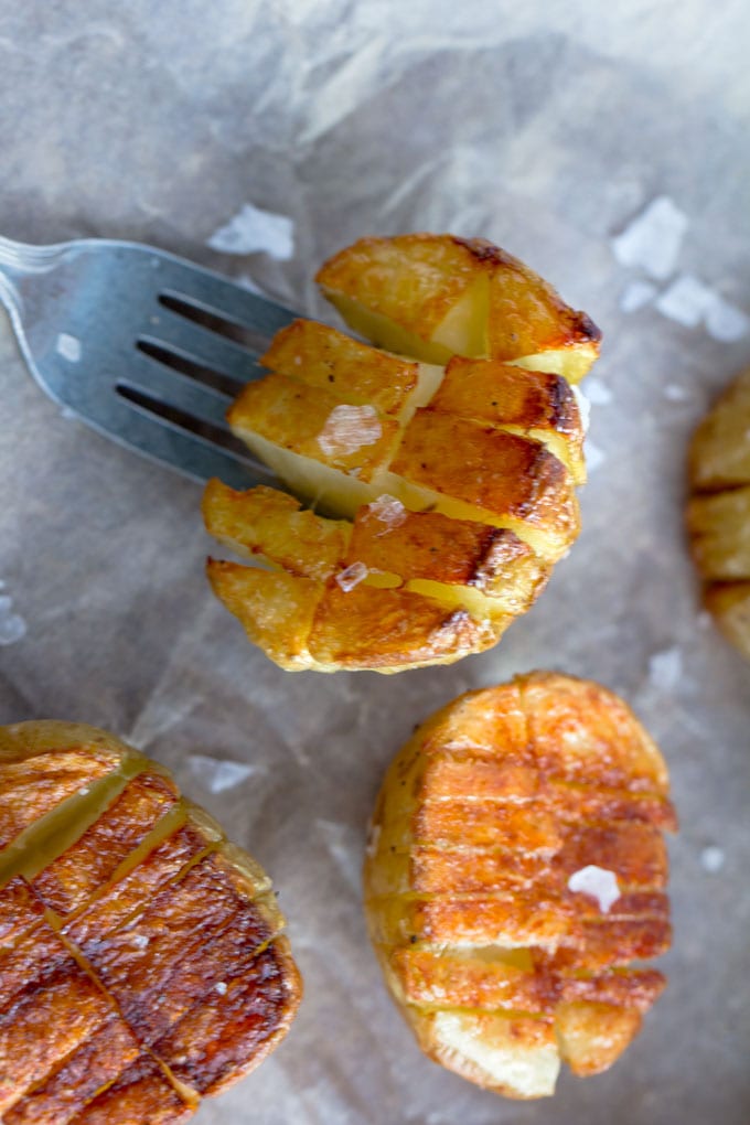 Mini inside-out hasselback potatoes are crisscross-cut mini potatoes that roast up extra golden brown and crispy on the outside and creamy inside. Whether you season these with salt and pepper or fancy them up with truffle salt and grated parmesan, they're delicious and fun and everyone will love them!