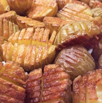 Mini inside-out hasselback potatoes are crisscross-cut mini potatoes that roast up extra golden brown and crispy on the outside and creamy inside. Whether you season these with salt and pepper or fancy them up with truffle salt and grated parmesan, they're delicious and fun and everyone will love them!