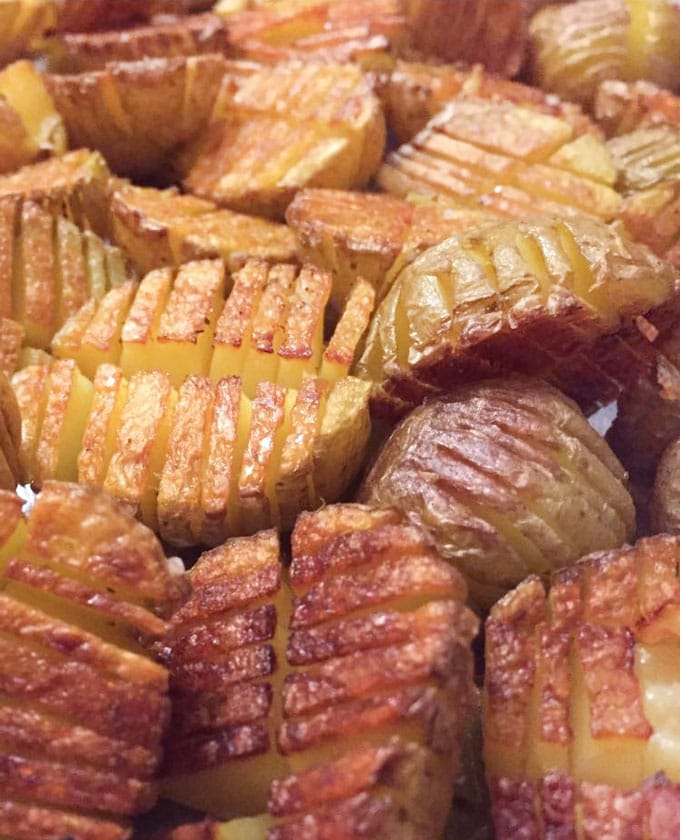 Mini inside-out hasselback potatoes are crisscross-cut mini potatoes that roast up extra golden brown and crispy on the outside and creamy inside. Whether you season these with salt and pepper or fancy them up with truffle salt and grated parmesan, they're delicious and fun and everyone will love them!