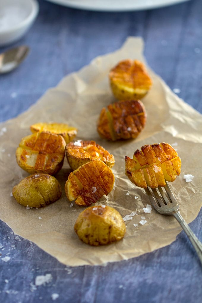 Mini inside-out hasselback potatoes are crisscross-cut mini potatoes that roast up extra golden brown and crispy on the outside and creamy inside. Whether you season these with salt and pepper or fancy them up with truffle salt and grated parmesan, they're delicious and fun and everyone will love them!