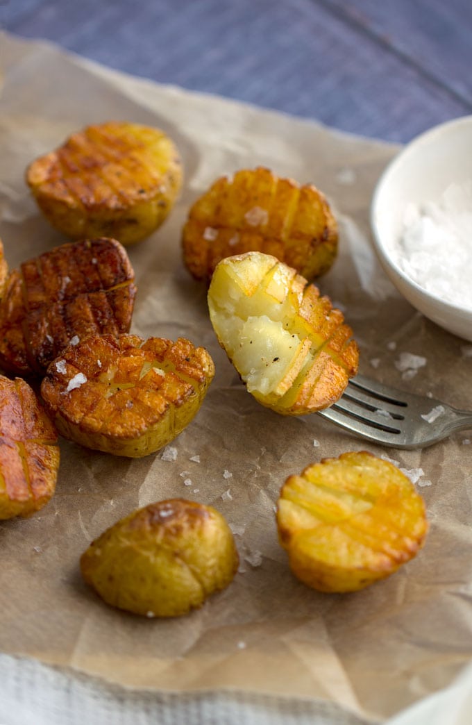 Mini inside-out hasselback potatoes are crisscross-cut mini potatoes that roast up extra golden brown and crispy on the outside and creamy inside. Whether you season these with salt and pepper or fancy them up with truffle salt and grated parmesan, they're delicious and fun and everyone will love them!