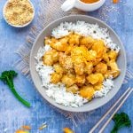 Chinese orange chicken over rice with orange sauce