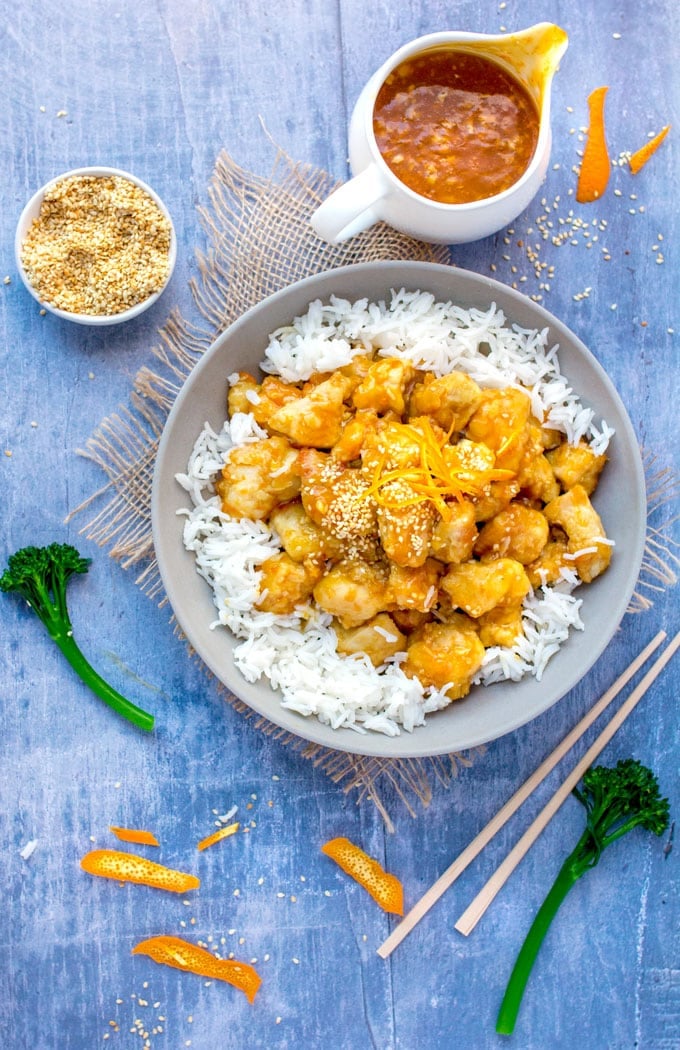 Chinese orange chicken over rice with orange sauce