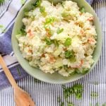 A bowl of Japanese potato salad topped with scallions