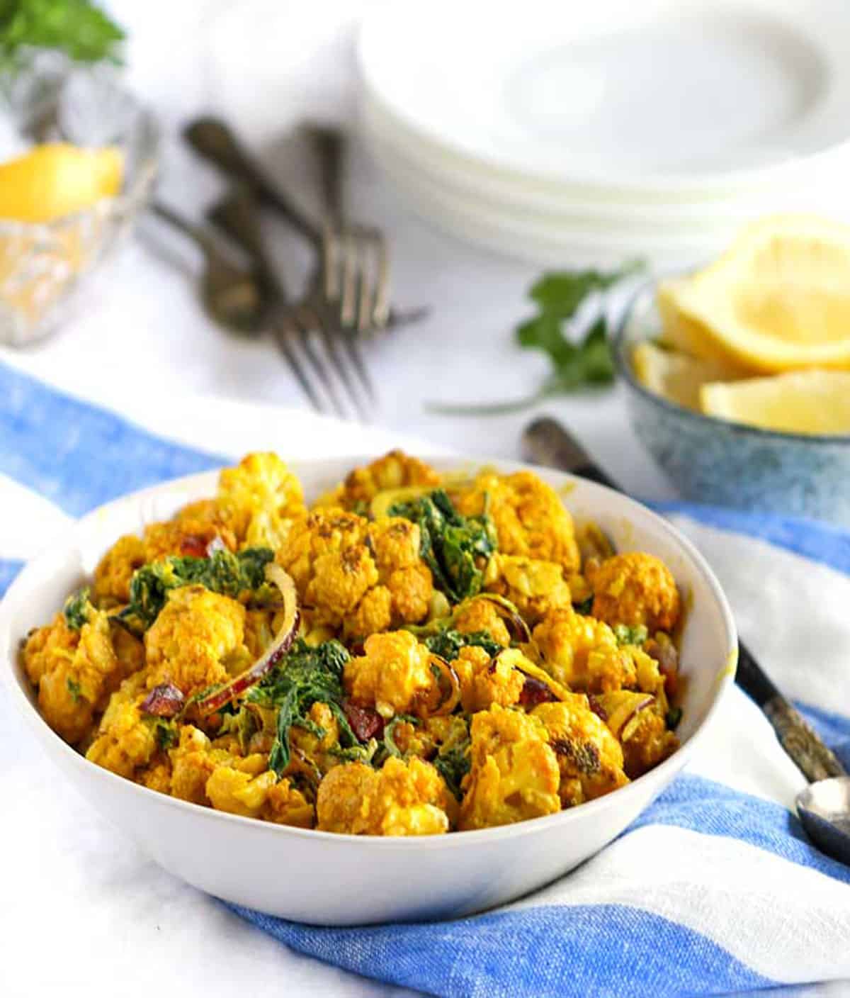 turmeric roasted cauliflower salad with spinach.