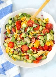 A bowl of corn tomato avocado salad