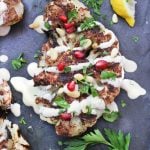 cauliflower shawarma with tahini sauce and pomegranate seeds