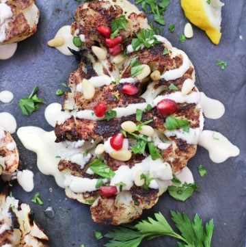 cauliflower shawarma with tahini sauce and pomegranate seeds