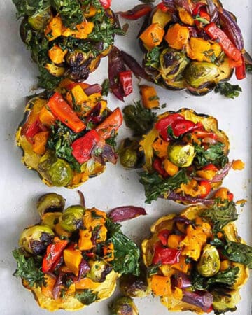 6 roasted squash halves stuffed with a rainbow of roasted fall vegetables.