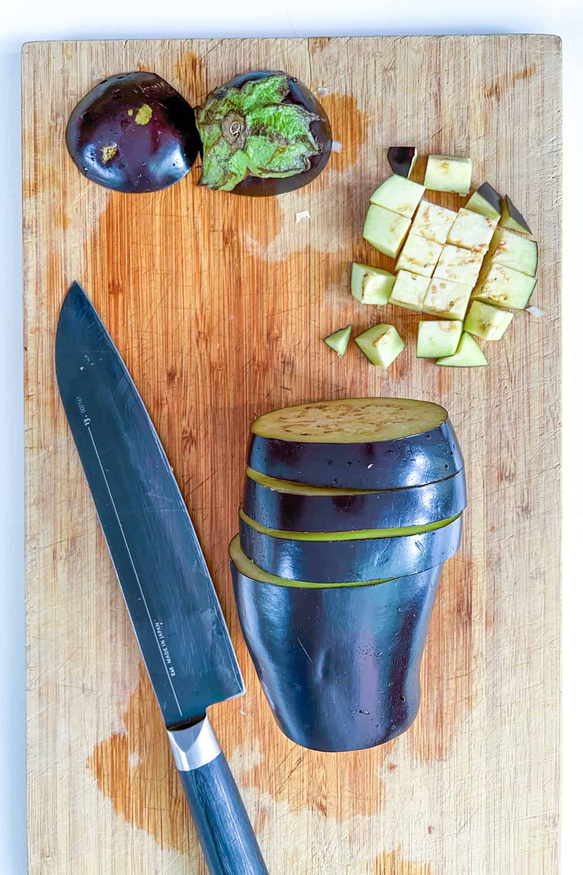 an eggplant cut into rounds, then each round is cubed