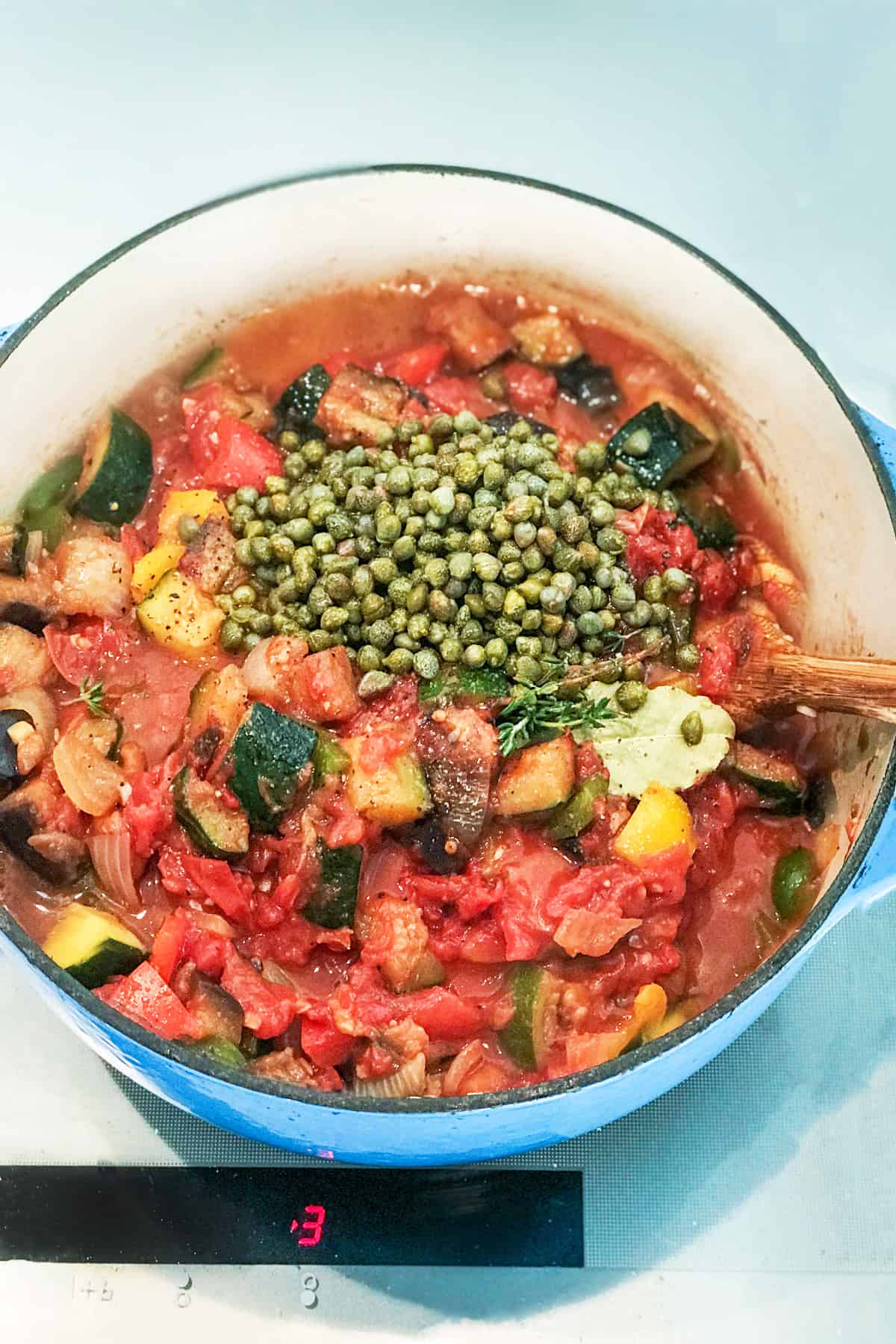 Capers added to pot of ratatouille