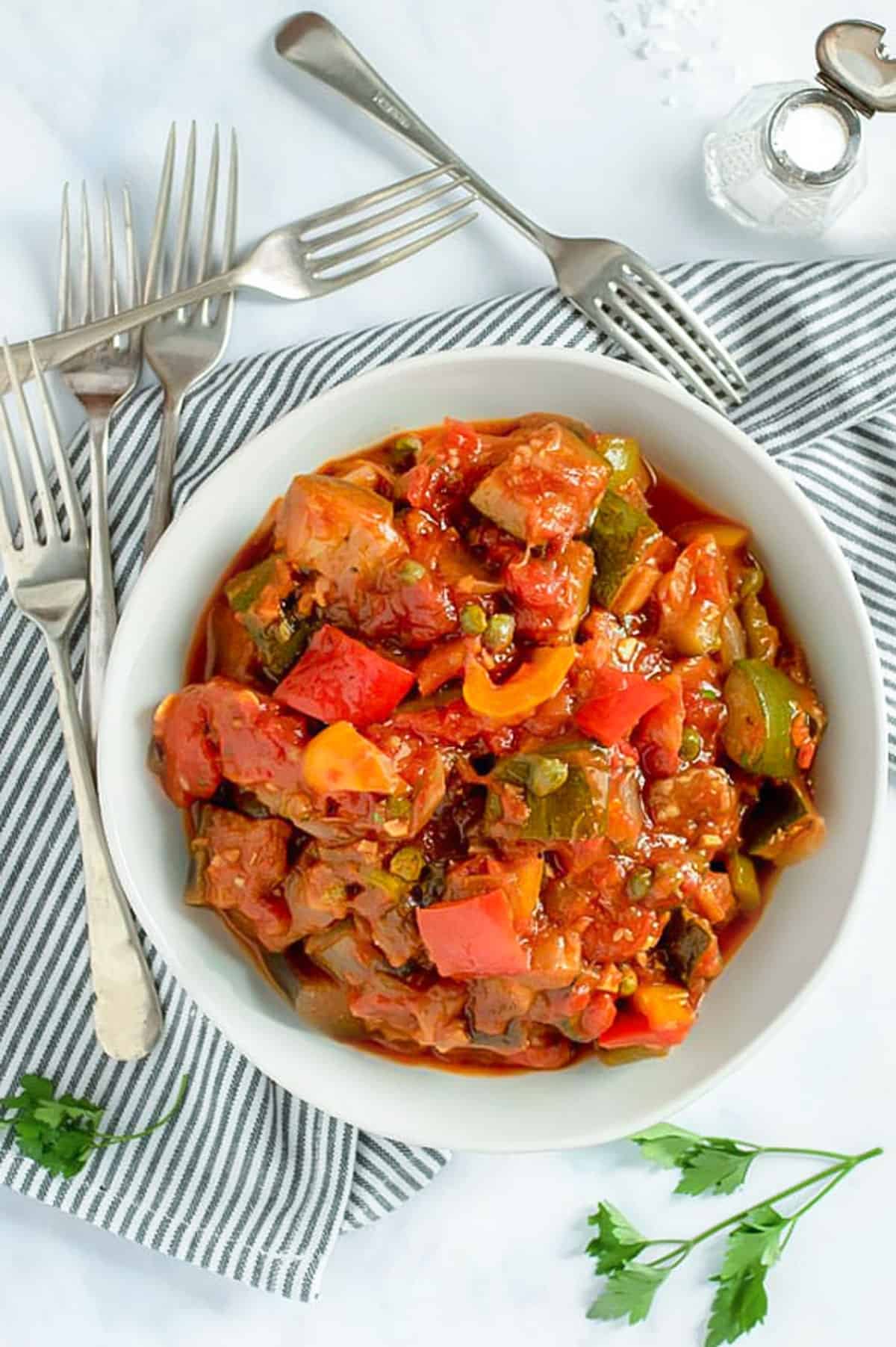 Ratatouille in a bowl surrounded by 5 forks