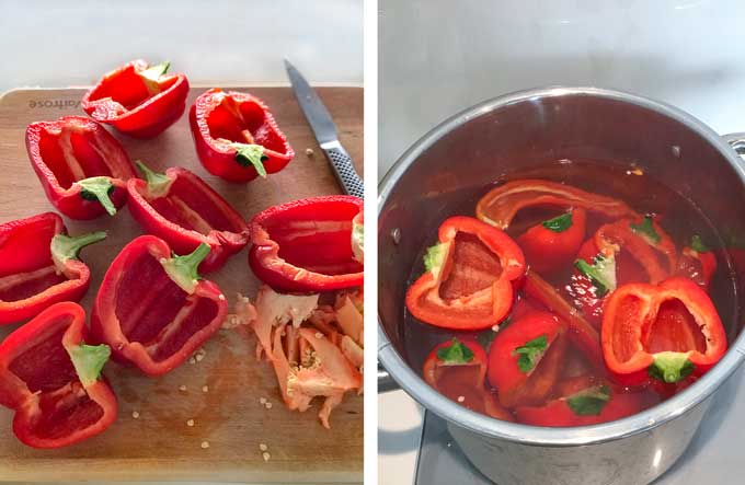 several halved red peppers on a cutting board and a pot of water with red pepper halves