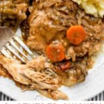 Pinterest Pin: close up of a piece of smothered chicken with a fork stuck into a tender-looking piece