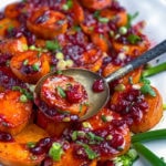 platter of roasted sweet potatoes with cranberries