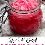 glass jar filled with bright pink pickled red onions