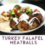 a white plate with 5 turkey falafel meatballs drizzled with lemon yogurt sauce, some chopped Israeli salad and a piece of pita bread