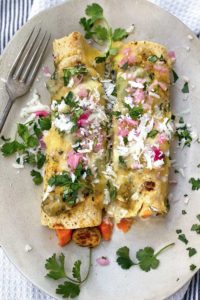 2 vegetarian Enchiladas Verdes with sweet potatoes and brussels sprouts