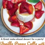 gold-rimmed white plate topped with vanilla panna cotta and strawberries