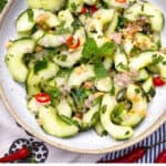 Pinterest pin: Thai cucumber salad in a white bowl