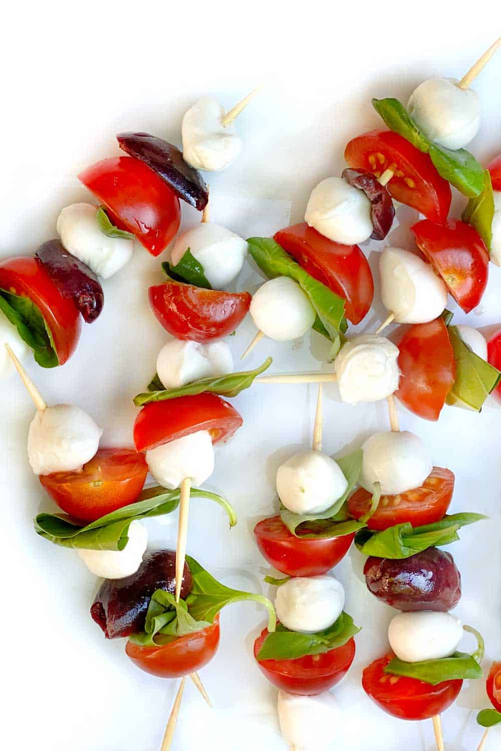 close up of 8 mini caprese skewers