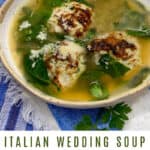 PInterest pin: a bowl of Italian wedding soup with broth, 3 meatballs and greens