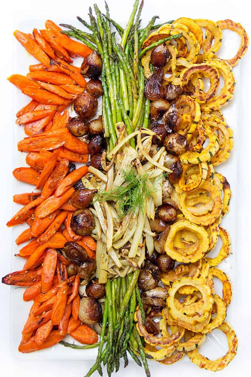 platter of colorful roasted veggies: carrots, asparagus, squash, onions and fennel
