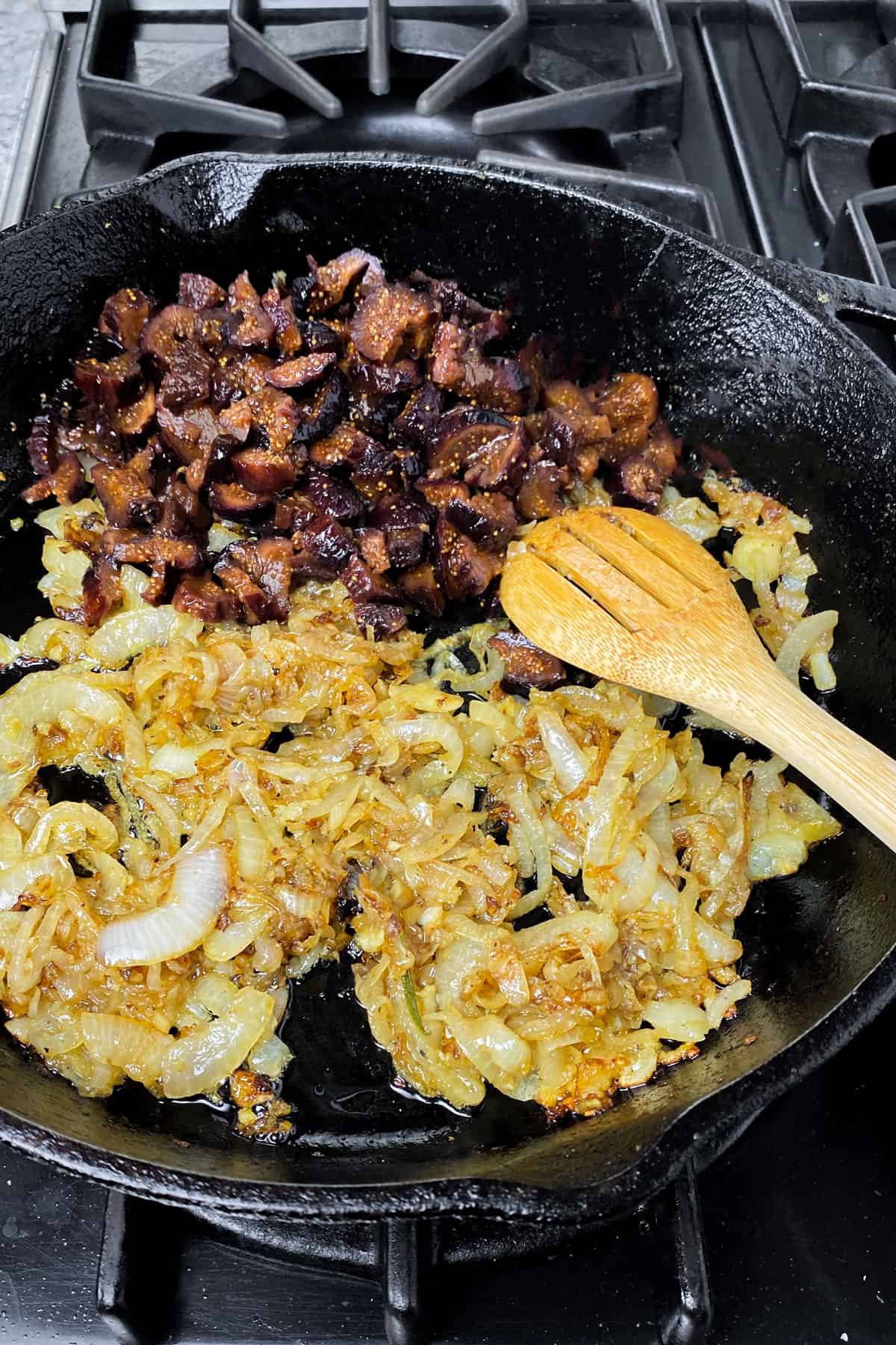 Caramelized onions and chopped figs in a cast iron skilelt