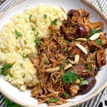 slow cooker chicken thighs and couscous in a white bowl