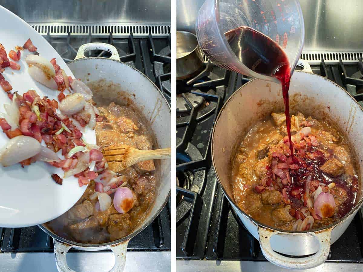 Bacon and onions being added to a white oval dutch oven that's filled with sautéed beef, then red wine being poured in