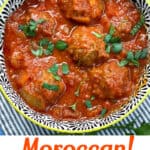 A bowl of Moroccan meatballs in tomato sauce with a sprinkling of chopped parsley