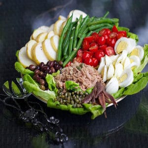 tuna nicoise salad arranged on a platter.