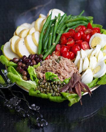 tuna nicoise salad arranged on a platter.