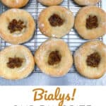 Pinterest Pin: 9 bialys on a metal cooling rack