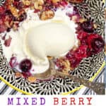 pinterest pin, mixed berry crumble in a black and white bowl with a scoop of melting vanilla ice cream