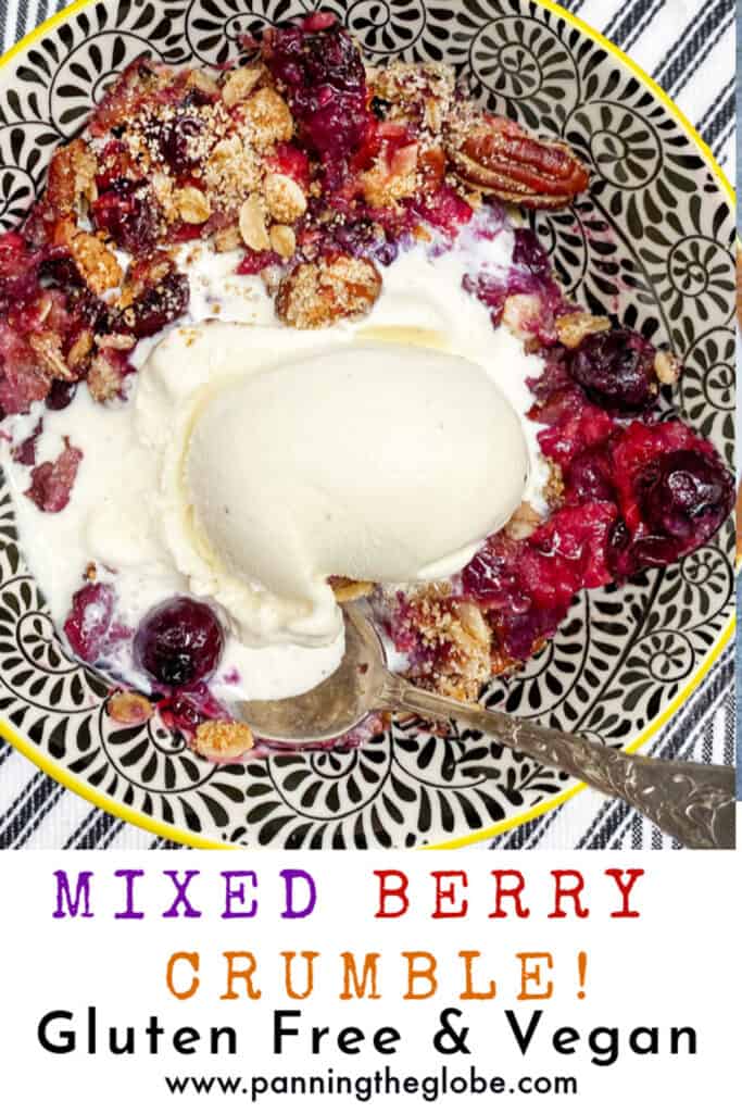 pinterest pin, mixed berry crumble in a black and white bowl with a scoop of melting vanilla ice cream