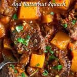 hunks of beef stew with butternut squash topped with chopped parsley
