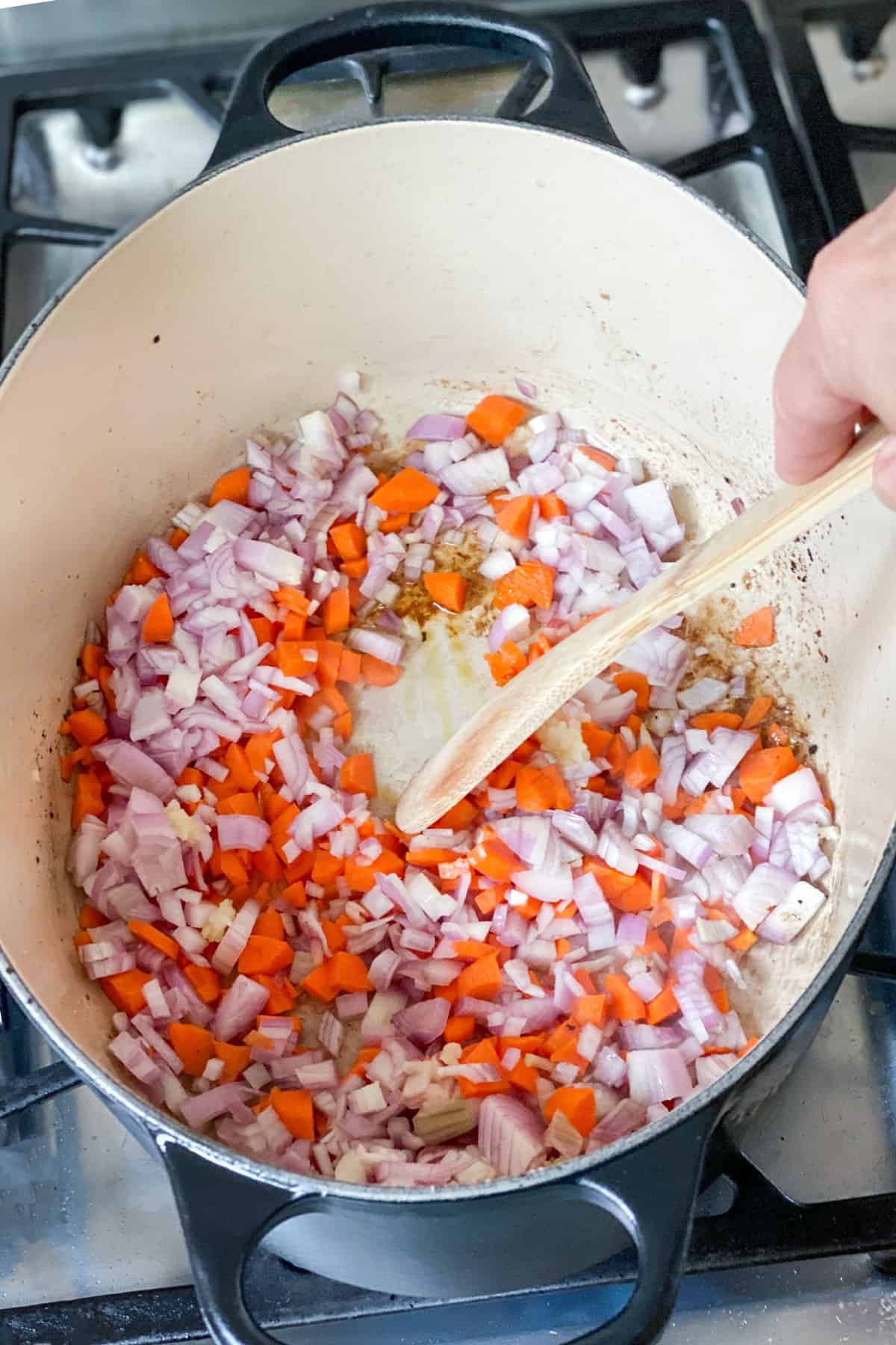 chopped carrots, shallots and garlic sauteeing in a dutch oven