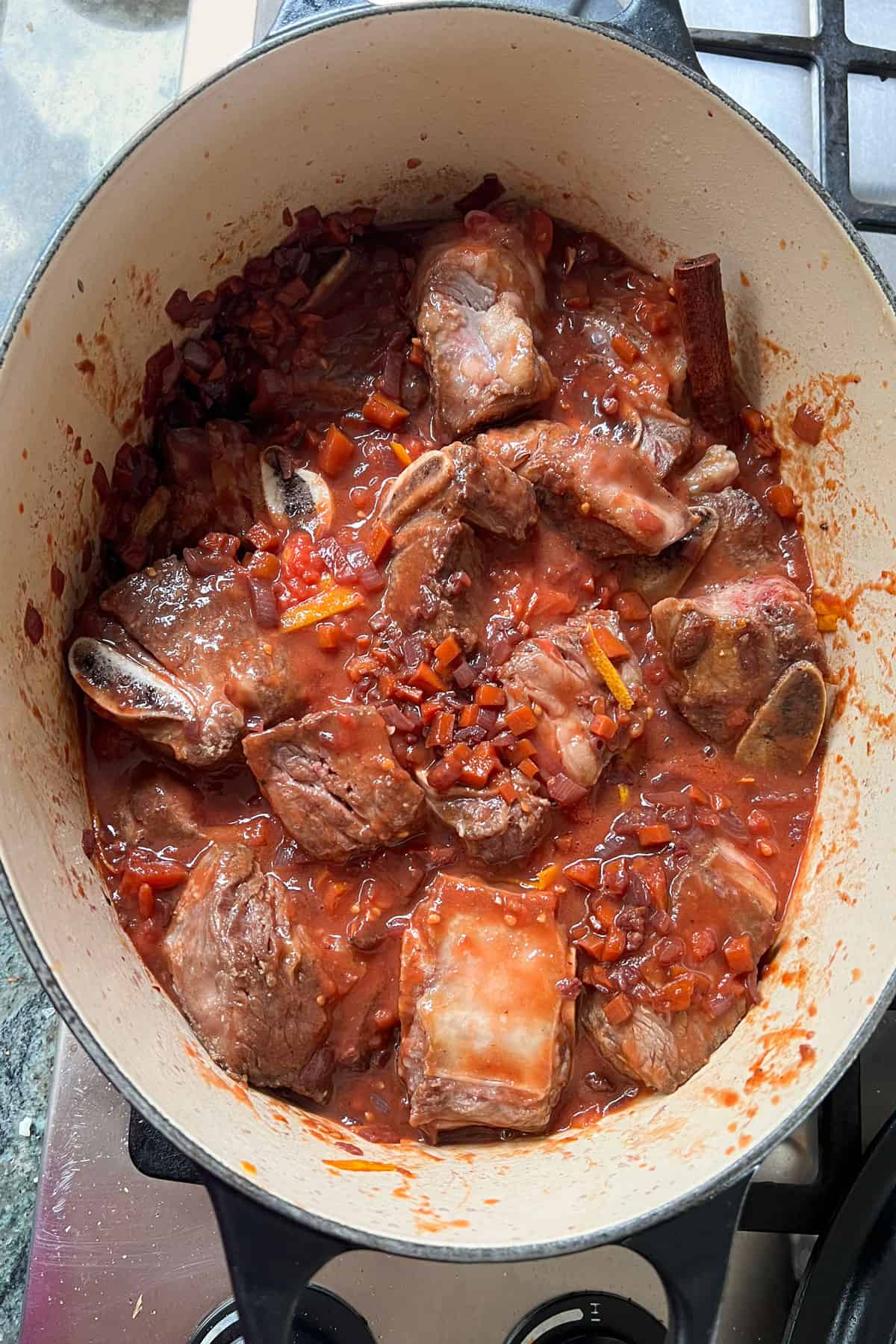 short rib beef stew in a pot ready to go into the oven.