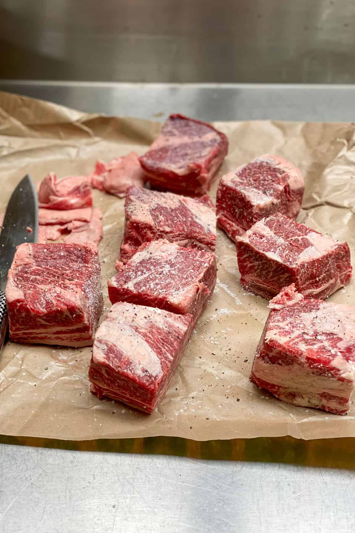 4 pounds of beef short ribs on a piece of parchment paper.