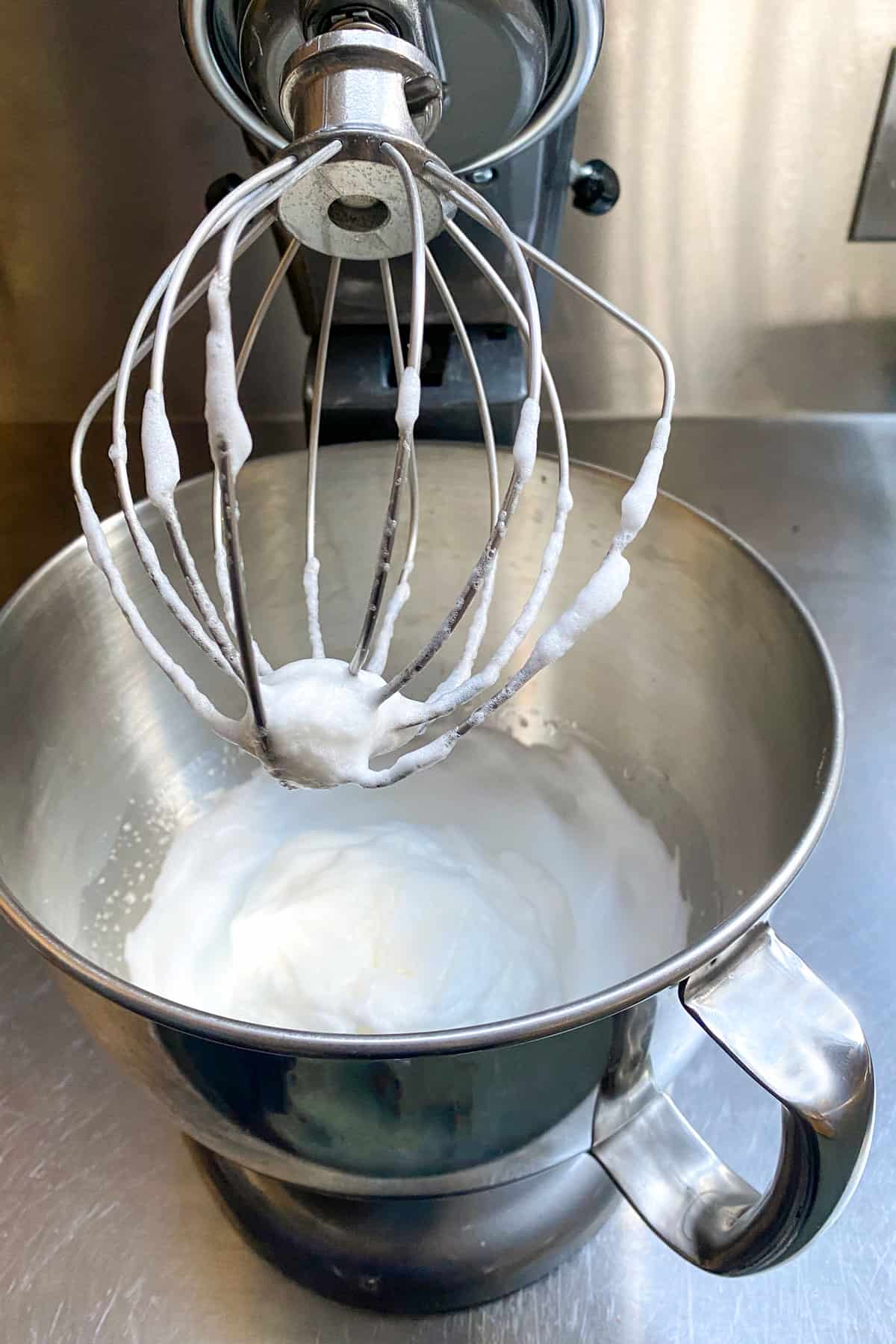 looking into an electric mixer filled with whipped cream