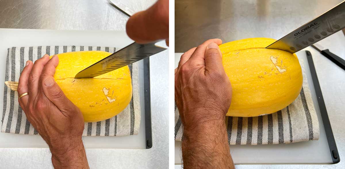 Large knife cutting into pre-cut slits on a spaghetti squash, cutting it in half lengthwise